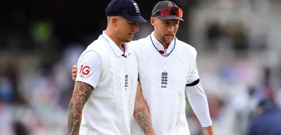 Two England cricketers walking off the field