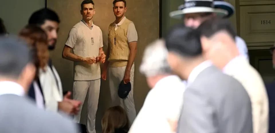 Crowd with portrait of two cricket players in background
