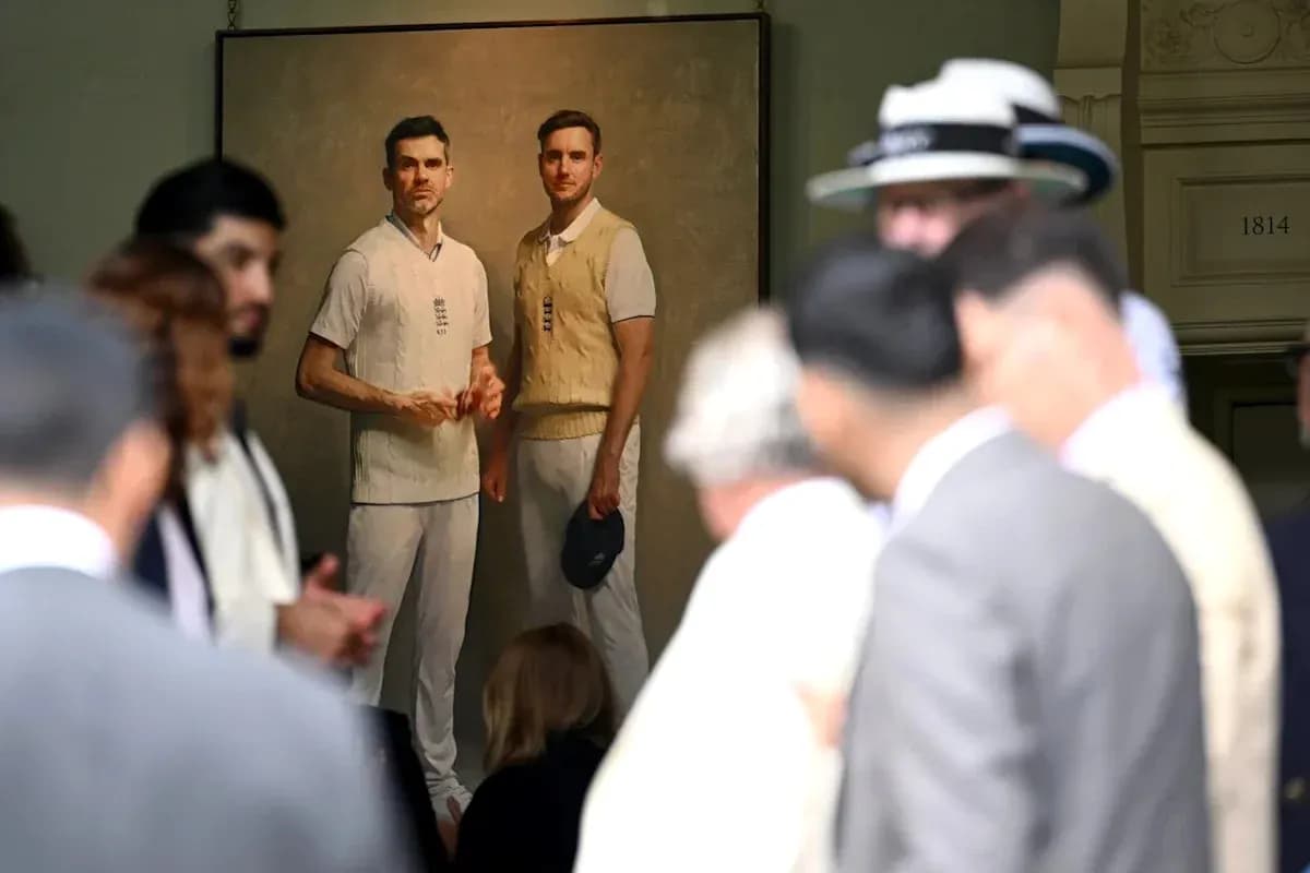 Crowd with portrait of two cricket players in background