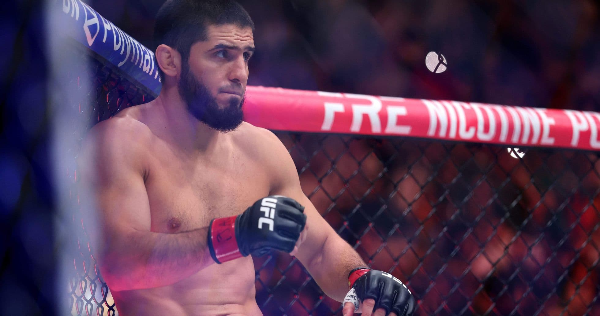 Fighter resting in UFC octagon before match