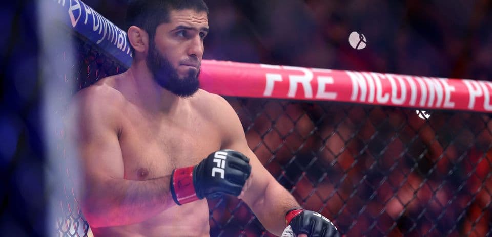 Fighter resting in UFC octagon before match