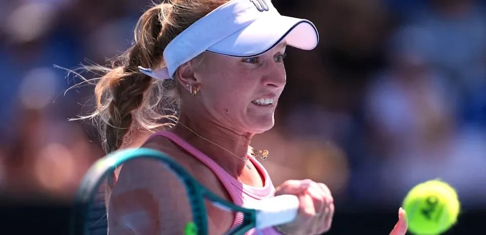 Female tennis player preparing to hit a ball