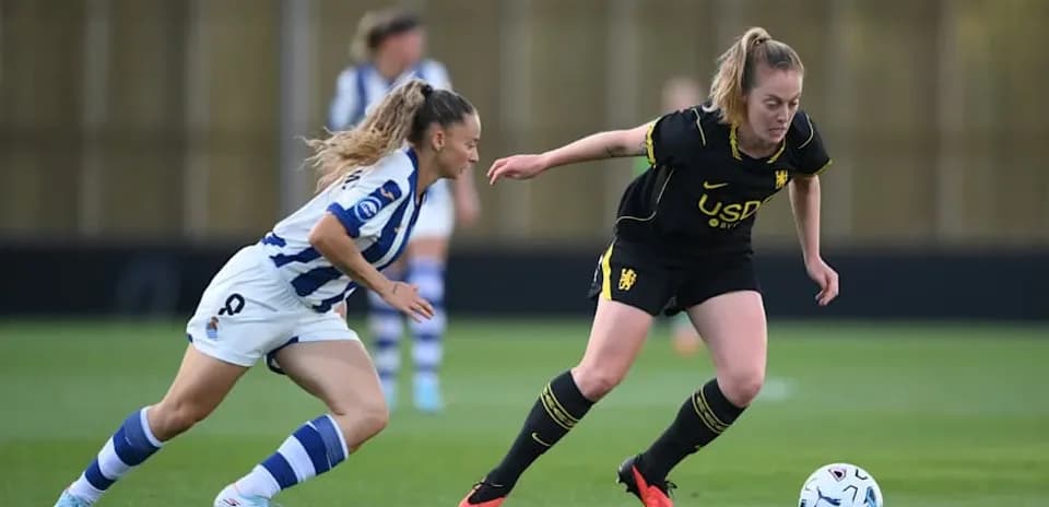 Two players competing for the ball on field