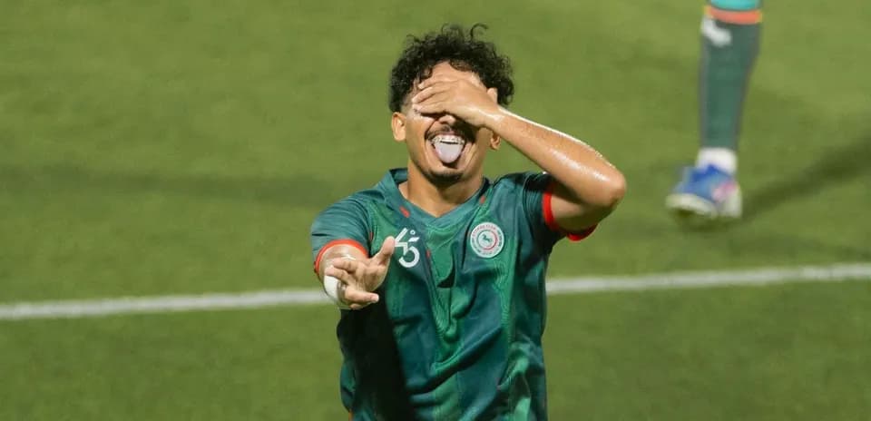 Player celebrating with playful gesture on field