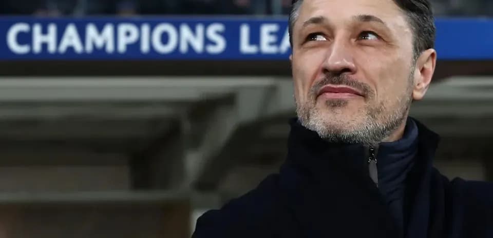 Coach looking up during Champions League match