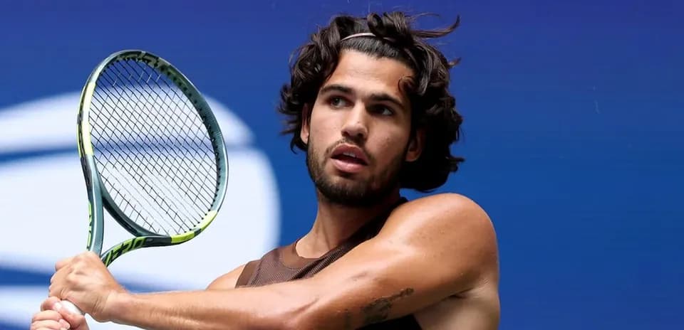 Tennis player preparing to hit a backhand shot