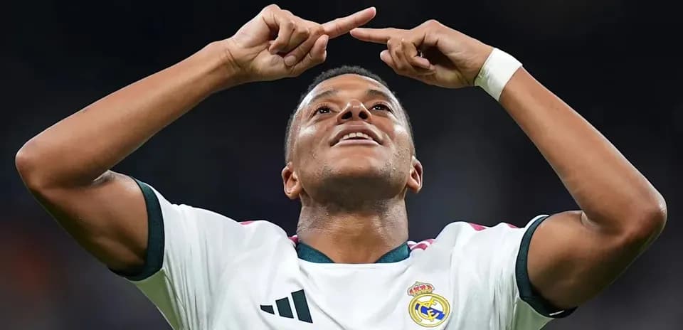 Player celebrating a goal with arms raised