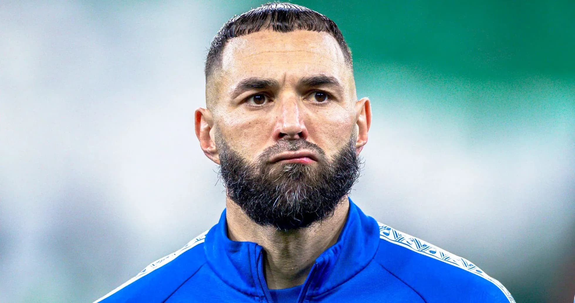 Player wearing blue training kit on the field