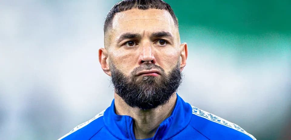 Player wearing blue training kit on the field