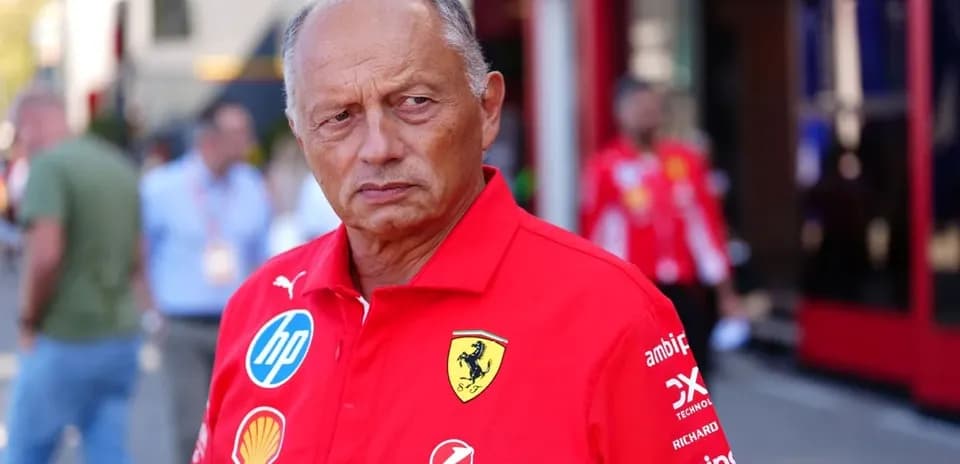 Team member in Ferrari attire at the paddock