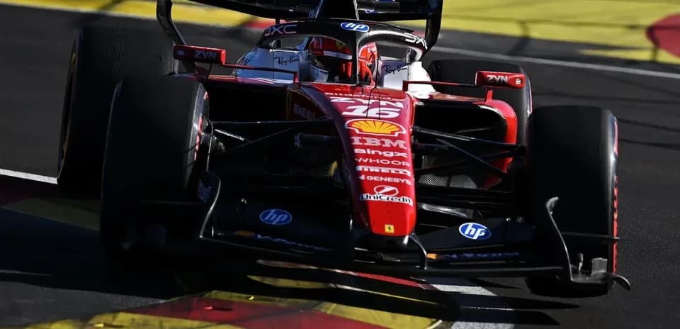 Ferrari car taking a turn on racetrack