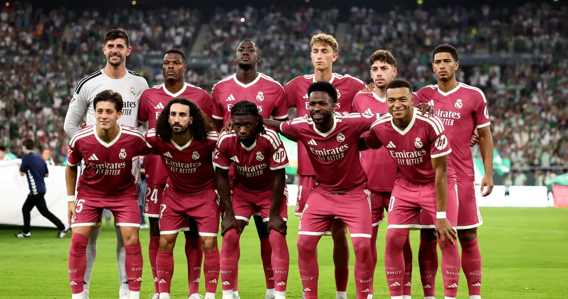 Real Madrid team posing before match in pink uniforms