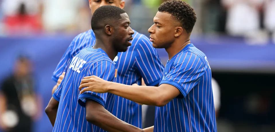 Players interacting on the pitch before the match