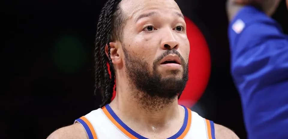 Player wearing Knicks jersey during game action