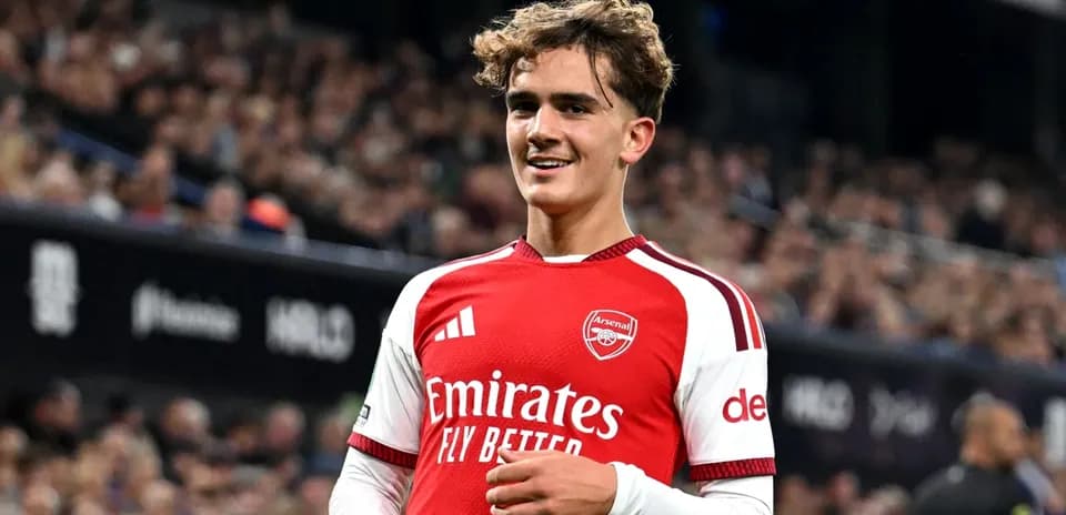 Arsenal player smiling on the pitch during match