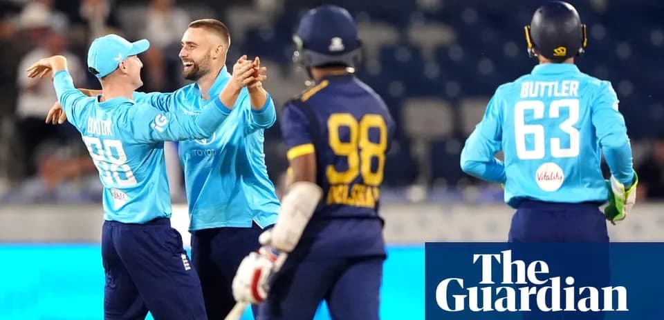 England players celebrating a wicket during match