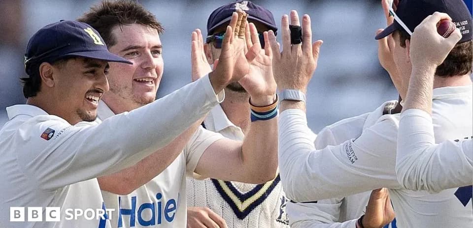 Cricket team celebrating after a wicket taken