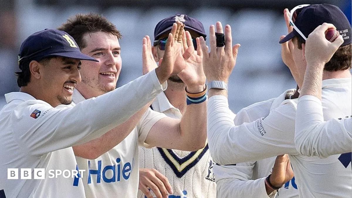 Cricket team celebrating after a wicket taken