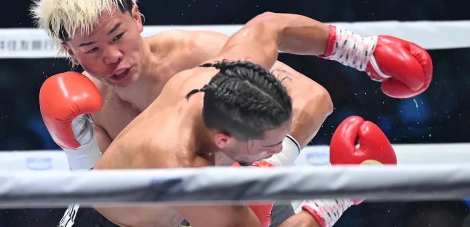 Boxer delivering a punch during a match