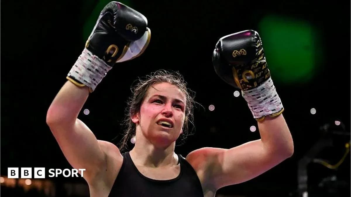 Female boxer celebrating victory with raised fists
