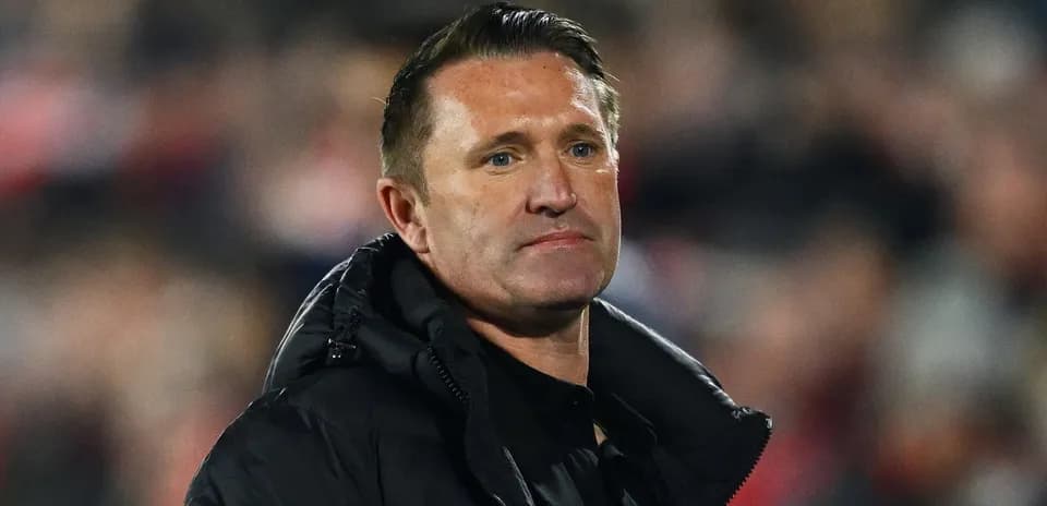 Manager observing the match from the sidelines
