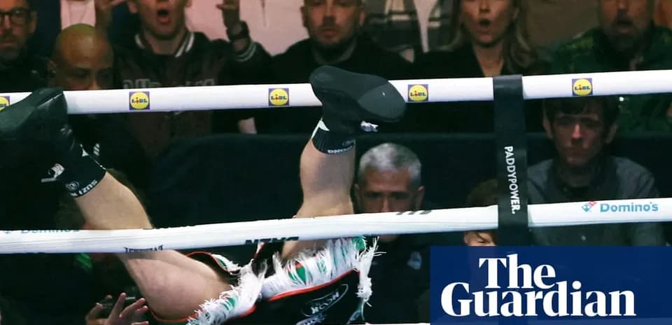 Boxer falling through ropes during a match