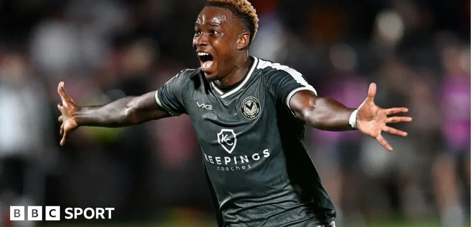 Player celebrating a goal with outstretched arms