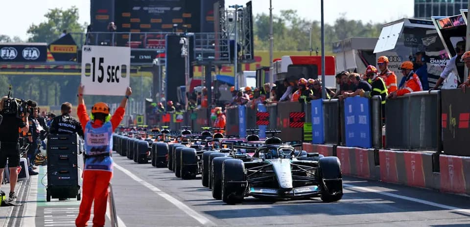 Pit lane with cars and officials during Formula 1 race