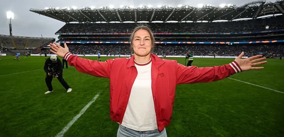 Person celebrating on the pitch at a stadium