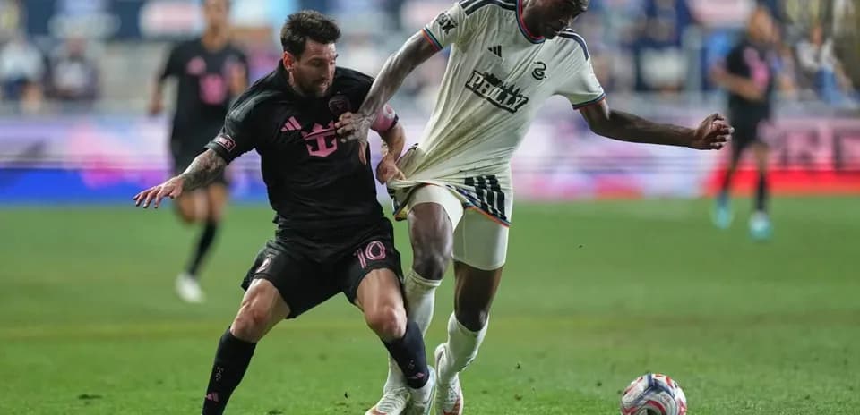 Lionel Messi challenges a Philadelphia Union player