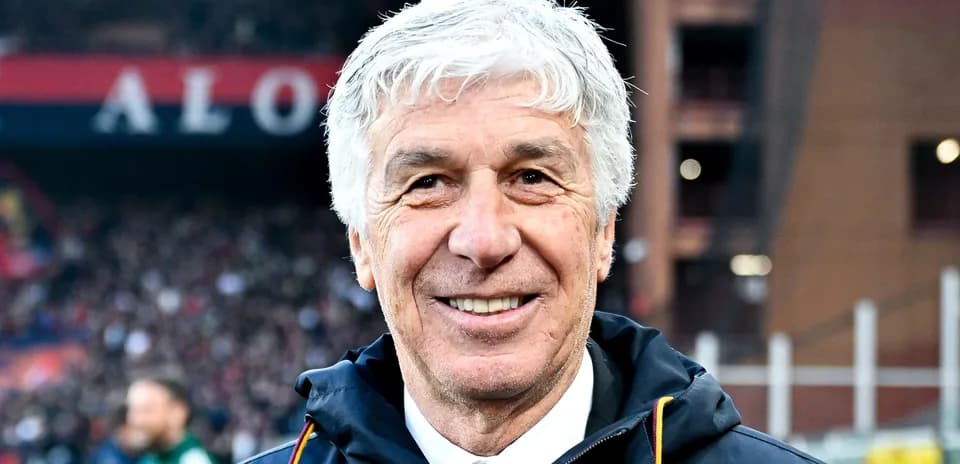 Coach smiling during a match at the stadium
