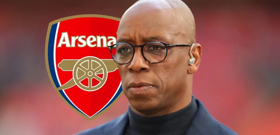 Former player in front of Arsenal logo backdrop