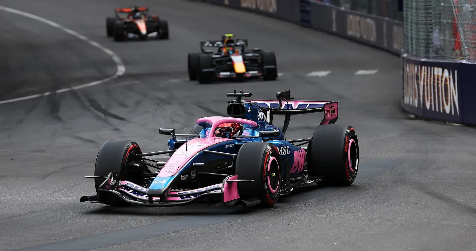 Formula 1 car racing around a track corner