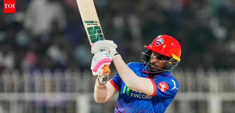 Batter playing a shot during a cricket match