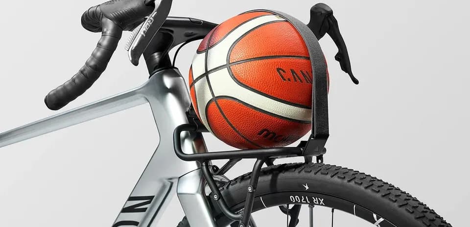 Basketball secured on bicycle frame rack