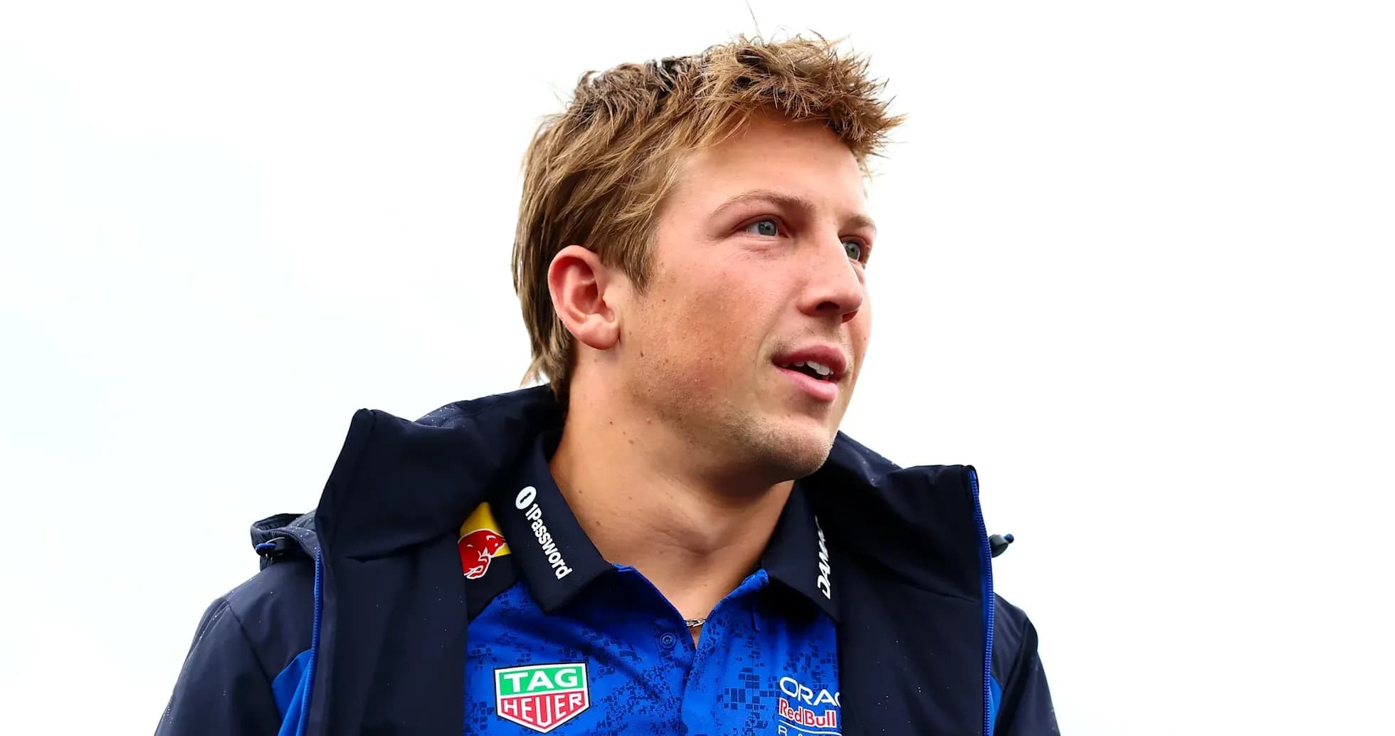 Driver wearing team jacket and polo shirt