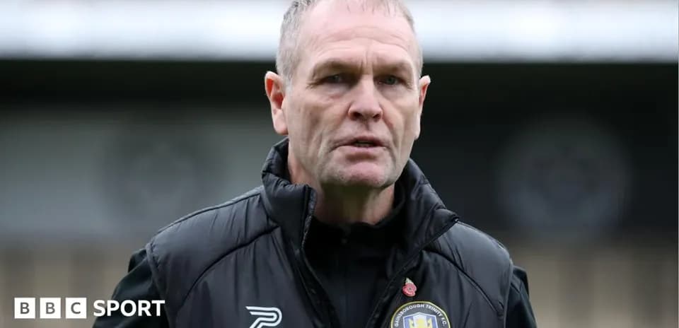 Manager speaking on the sidelines during match