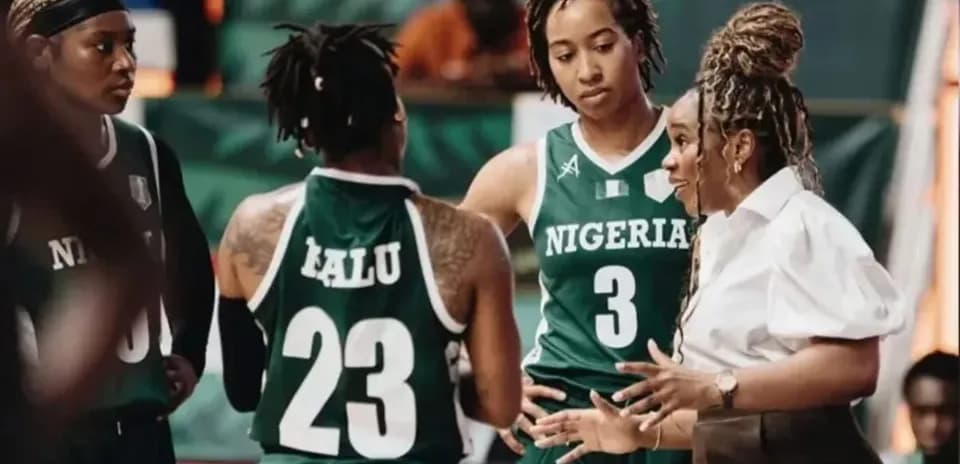 Coach discussing strategy with Nigerian basketball players