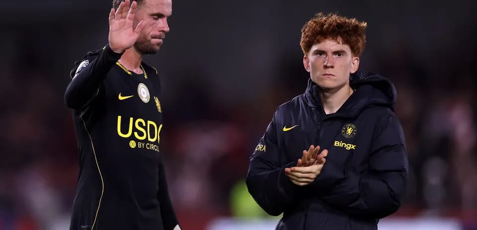 Two players acknowledging fans after match