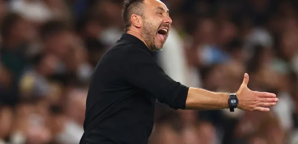 Coach gesturing during a match from the sidelines