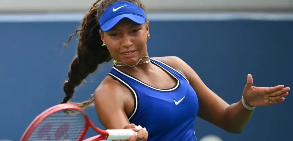 Tennis player preparing to hit a forehand stroke