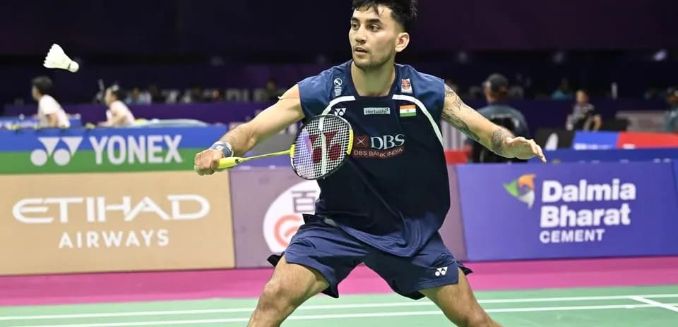 Player preparing to hit a shuttlecock in badminton match