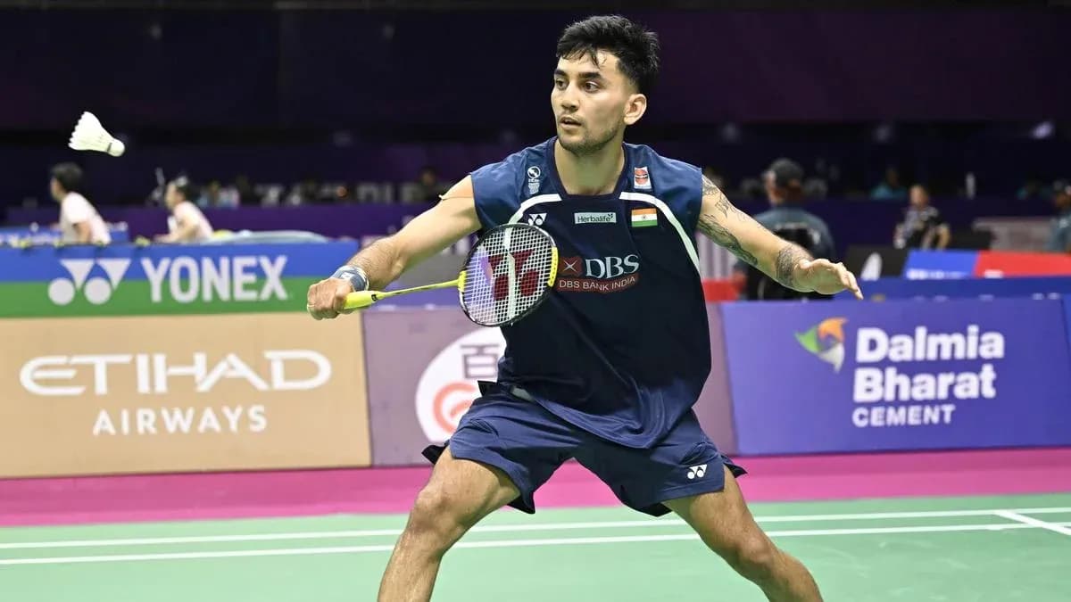 Player preparing to hit a shuttlecock in badminton match