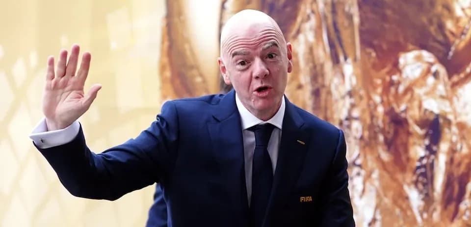 FIFA official gesturing during an event