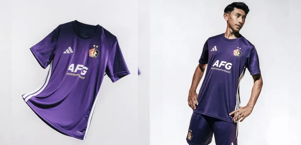 Purple football kit displayed and worn by player