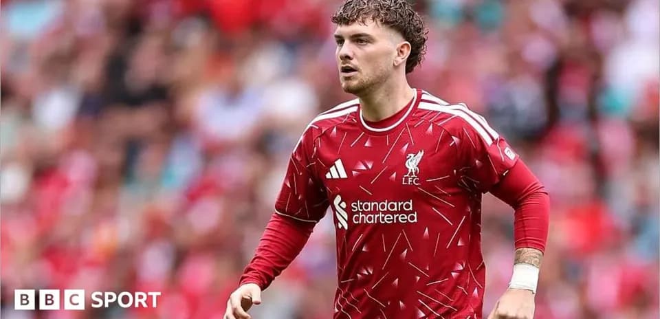 Liverpool player in red kit during match action