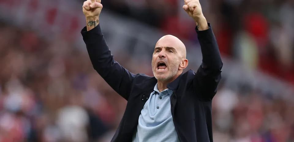 Coach celebrating a victory with raised fists