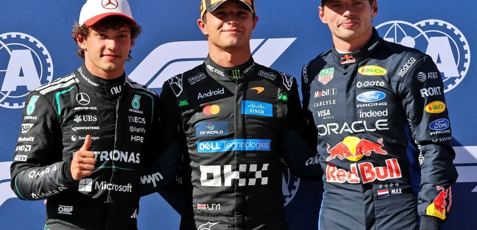 Three Formula 1 drivers posing for photo together