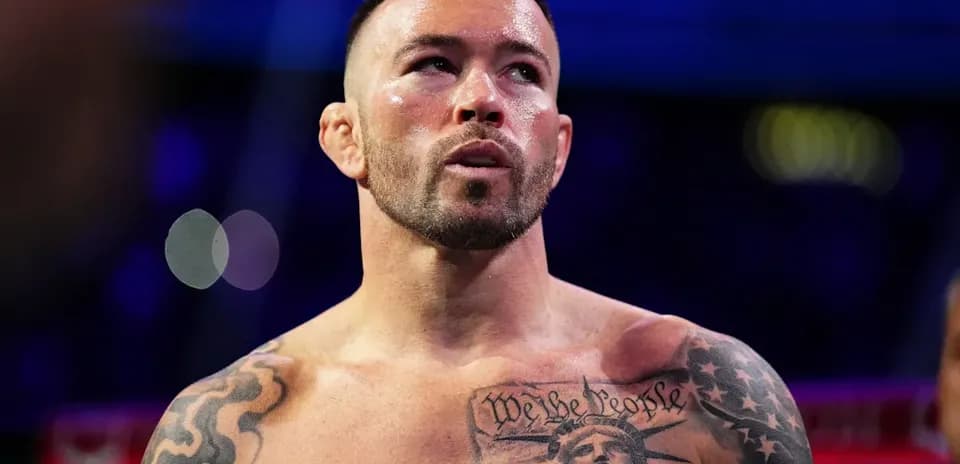 Bare-chested fighter with tattoos in the ring