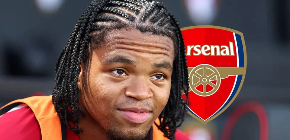 Player with braided hair next to Arsenal logo